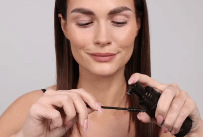 Model washing off the makeup from her eyelids